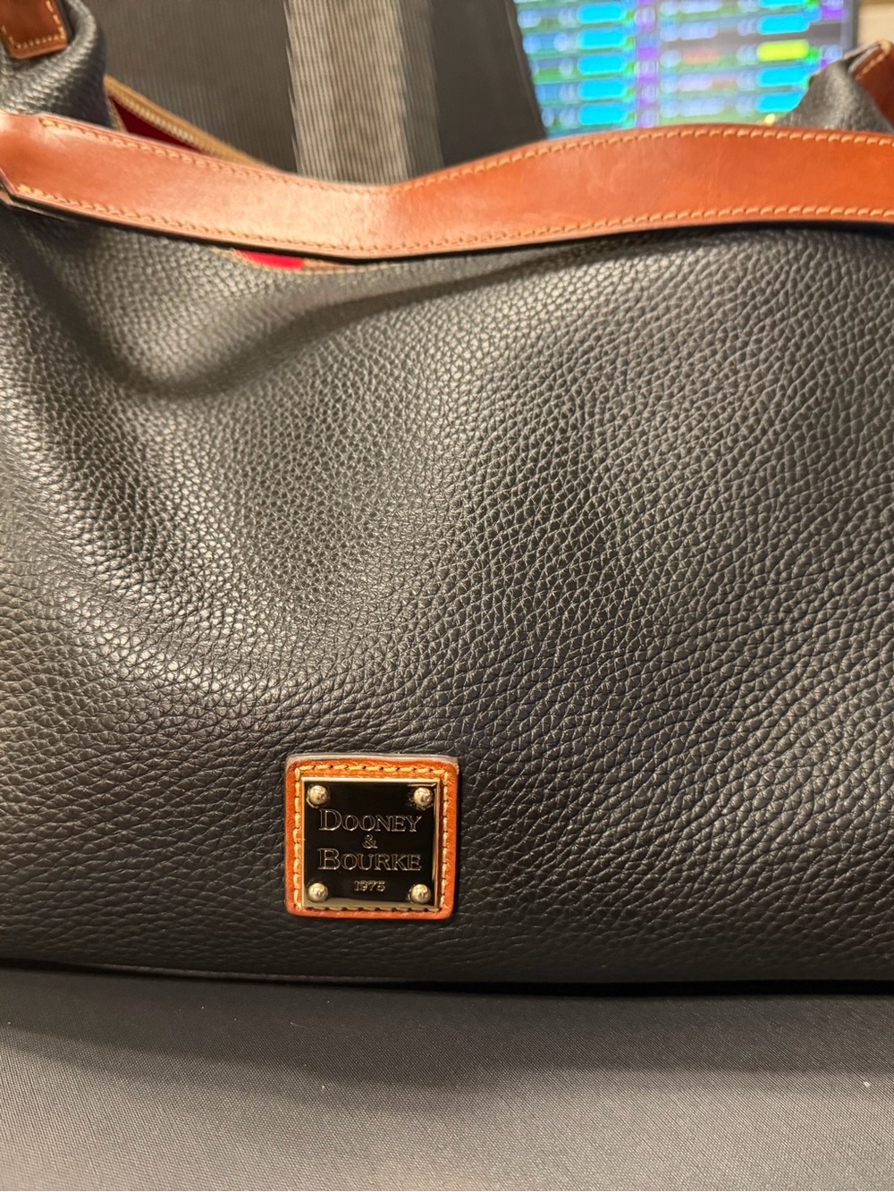 Dooney & Bourke Black Pebbled Leather Duffel with Brown Trim